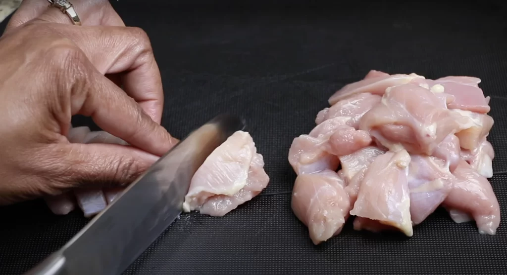 Cutting the chicken thighs